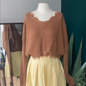 Cropped oversized distressed sweater